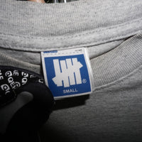 Small -Undefeated spell out hype essential neon gray t-shirt
